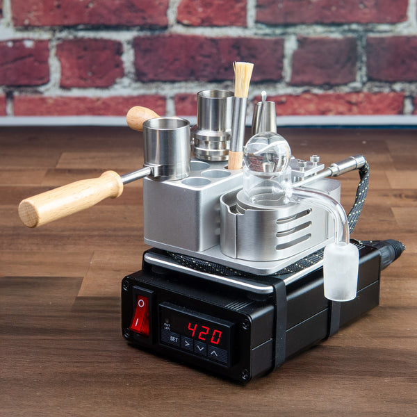 wohw wireless one hit wonder ball vape kit sitting on wooden bench